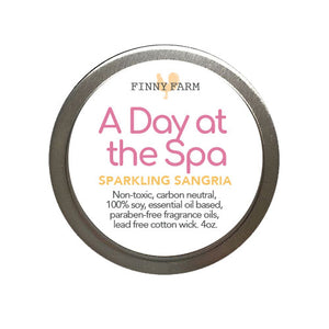 A DAY AT THE SPA CANDLE - A little toast of subtle fruity sparkling sangria. 100% soy. Non-toxic. Carbon-neutral. Lead-free cotton wick. Made with essential oils and paraben-free fragrance oils.Hand-poured into a travel tin with lid. Handmade by Finny Farm in Georgia. 4oz.