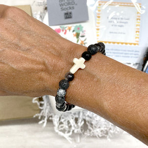 LAVA STONE BRACELET- Lava Stones, igneous volcanic rock. Said to give strength and courage, allowing stability through times of change. And provide guidance and understanding in situations where we aim to prevail. Lava Stone is a wonderful aromatherapy essential oil diffuser. Add a few drops of your favorite essential oil and enjoy the added therapeutic benefits it brings. A cross to remember to stay strong in your faith and you will prevail. Handmade with love by July Rae O’Sunshine in Georgia.