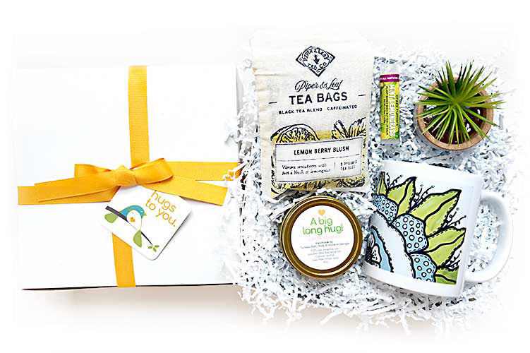 A New Day Hug Box gift. Send tea, candles and other goodies in a Hug Box. A gift delivery specializing in sustainable locally made artisan products that SEND A HUG. Perfect for employee, client, friend or family member for get well, thinking of you or birthday!