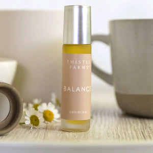 BALANCE ESSENTIAL OIL - Balance Scent consists of lavender, lemon + rose geranium, an uplifting blend that harmonizes the mind and improves mood.&nbsp;Made by the women of the nonprofit, Thistle Farms, a safe haven for healing, combining secure housing, meaningful employment, and lifelong sisterhood, in Tennessee. Roll-on. 10ml.