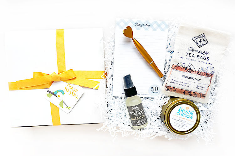 Be Still and Know Hug Box. Send a hug to bring stillness and comfort. A meaningful gift for get well, sympathy, thinking of you. Filled with products created by local Georgia artisans, woman-owned small businesses and the nonprofit, Thistle Farms. A gift the gives back.