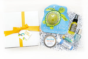 Send them to the beach with this Hug Box gift... right to their door. Filled with beachy local artisan goodies!