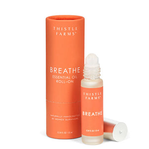 BREATH ESSENTIAL OIL - Breathe in the refreshing aroma of our Eucalyptus Peppermint "Breathe" blend. This invigorating fusion of Eucalyptus smithii, Niaouli, Peppermint, and Frankincense clears airways and minimizes seasonal threats, promoting a sense of clarity and well-being. Made bby the women of the nonprofit, THistle Farms in Tennessee..Roll-on. 10ml.