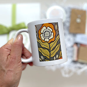 FLORAL MUG - This joyful floral illustration was created by Pick it Place Designs in Georgia. Dishwasher and microwave safe. 11 oz. Ceramic.