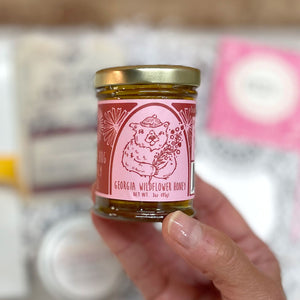GEORGIA WILDFLOWER HONEY - 100% pure, raw honey full of floral flavors and sweetness. A little bolder to the taste, and thicker in consistency by Bear Hug Honey and their hardworking bees in Georgia. The perfect healthy sweetener for coffee, tea or toast. 3oz.