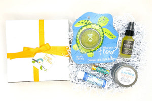 Send them to the beach with this Hug Box gift... right to their door. Filled with beachy local artisan goodies!