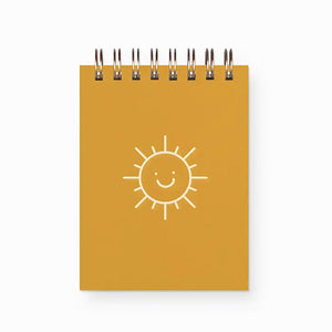 The perfect mini notebook to jot down a quick note wherever you are! This bright and cheery sun can fit in any bag, car, or catch all drawer. Or leave this happy sunshine on your desk and take notes as you go. 65 pages. Designed and printed on letterpress by Ruff House Art in Kansas.