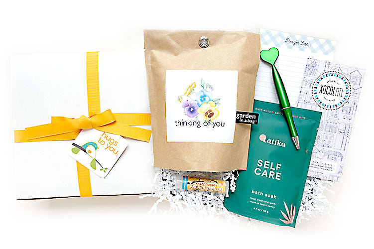 Thinking of You Hug Box gift. Send a box of hugs that will surely make them smile with blooms, sweets and soothing local artisan goodies. A meaningful way to say thinking of you for sympathy, cheer up, birthday.
