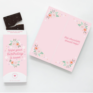 BIRTHDAY CHOCOLATE BAR - Made with soft vanilla caramel, cane sugar, fresh whipping cream, butter and Madagascar vanilla and topped with Mediterranean sea salt. Chocolatier uses only the finest clean ingredients, and has no artificial flavors or colors, no preservatives and no hydrogenated oils. Created by Sweeter Cards in Missouri. Employs adults with disabilities to assemble Sweeter Cards. We will sign you name on the Chocolate card which says, "Hope Your Birthday Is Sweet"