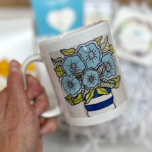 FLORAL MUG - This whimsical and joyful bouquet illustration was created by Pick it Place Designs in Georgia. Dishwasher and microwave safe. 11 oz. Ceramic.