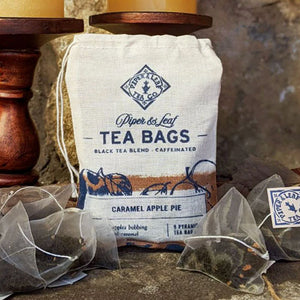 CARAMEL APPLE PIE TEA - Freshly harvested, late fall, cellar-root apples lend a crisp note to the decidedly creamy, mellow, and caramel-laced black tea. Ingredients: Ceylon Black Tea, Apples, Cinnamon, Ginger, Orange Rind, Star Anise, Licorice, Cloves, Organic Caramel Flavor, Black Pepper. Packaged in hand-printed muslin bags with 9 pyramid sachets of tea ready to brew. Handcrafted by Piper & Leaf in Alabama. Family-owned small business. Photo credit: Piper & Leaf