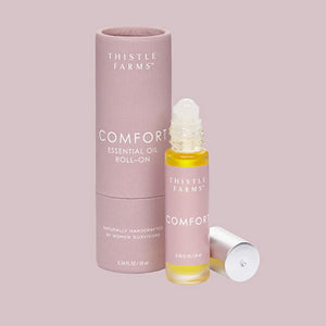 COMFORT ESSENTIAL OIL ROLL-ON - A soothing essential oil blend formulated to promote emotional balance. Its warming and relaxing scent combines clary sage, clove, and ylang-ylang, creating a comforting and harmonizing aroma. Also great to help alleviate menstrual cramps. Handmade by the women of Thistle Farms in Tennessee. 10ml
