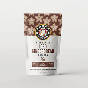 ICED GINGERBREAD POPCORN - They'll wrap themselves in the warmth of the season with Iced Gingerbread Popcorn—golden, crunchy kernels kissed with cozy gingerbread spices and finished with a velvety vanilla icing. Each bite feels like a holiday hug, sweet, spiced, and wonderfully comforting. Gluten-free. Non-GMO, No preservatives. Women-owned business. Made by Corks Popcorn in Georgia. 4.5 oz.