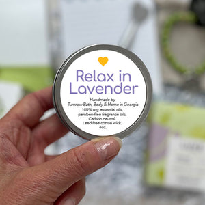RELAX IN LAVENDER CANDLE - 100% soy. Non-toxic. Carbon-neutral. Lead-free cotton wick. Made with essential oils and paraben-free fragrance oils to fill the room with subtle lavender calmness. Hand-poured into a travel tin with lid. Handmade by Turnrow Bath, Body &amp; Home in Georgia. 4 oz.