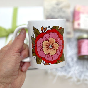 FESTIVE FLORAL MUG&nbsp;- A little happy to add with their tea or coffee. Original acrylic painting created by Pick it Place Designs in Georgia and printed on mug. Ceramic. Dishwasher and microwave safe. 11oz.&nbsp;