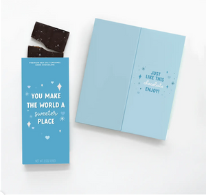 YOU MAKE THE WORLD A SWEETER PLACE DARK CHOCOLATE&nbsp;- A greeting card and chocolate bar ALL IN ONE (we will sign your name on it), "You make the world a sweeter place" Just like this chocolate."&nbsp;&nbsp;Woman-owned! Fair Trade Certified, Ethically Sourced.&nbsp;Each bar is made with soft vanilla caramel, cane sugar, fresh whipping cream, butter and Madagascar vanilla––and always topped with Mediterranean sea salt. Chocolatier uses only the finest clean ingredients, and has no artificial flavors or col