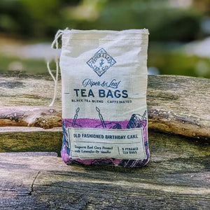 OLD FASHIONED BIRTHDAY CAKE TEA- A celebration in a cup of tea. Artisan black tea blended with all-natural ingredients such as bergamot, vanilla and lavender flowers. Handmade by Piper and Leaf in Alabama. 9 silky pyramid sachets ready to brew.
